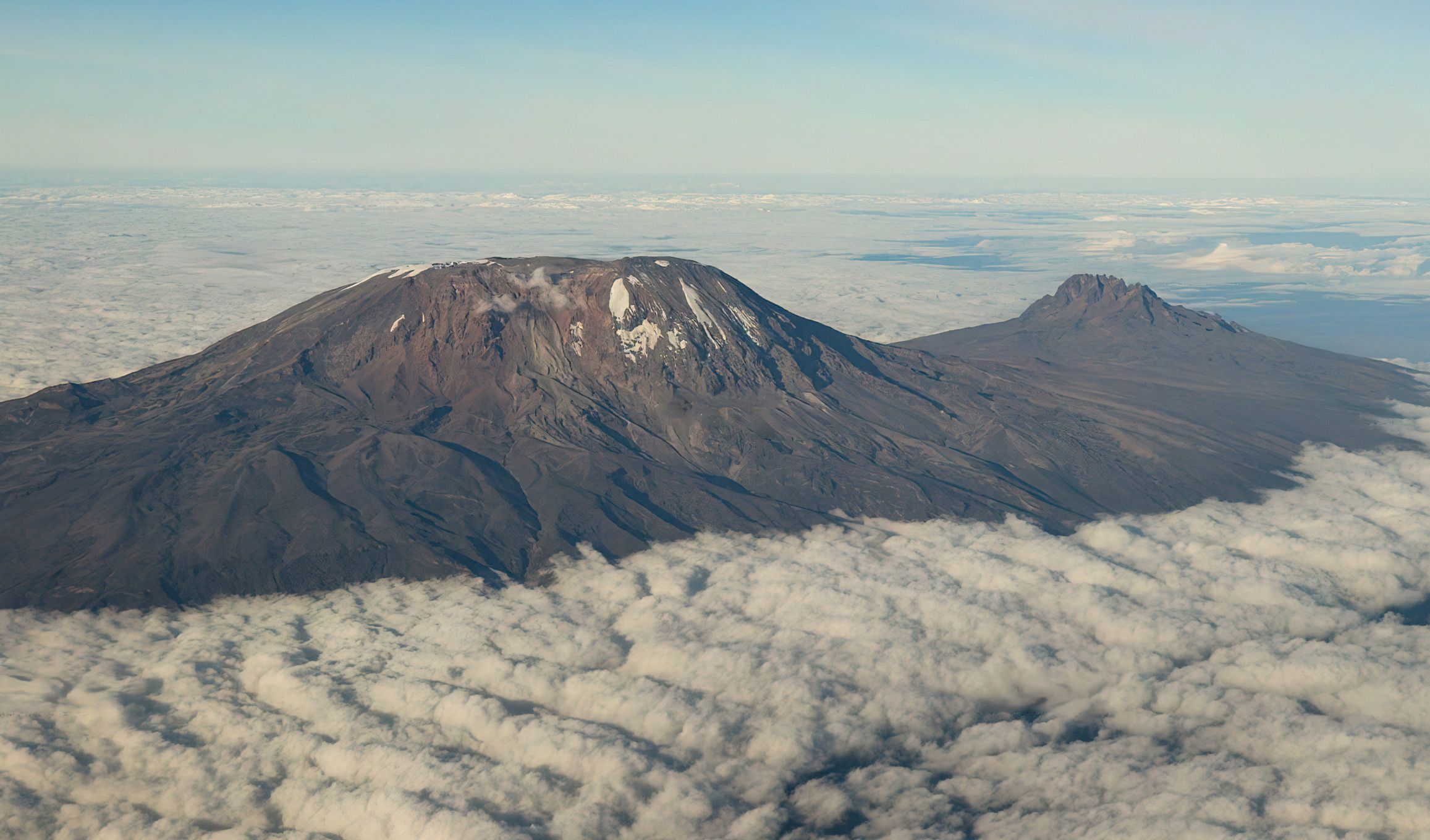 Mount Kilimanjaro towering above the Tanzanian landscape