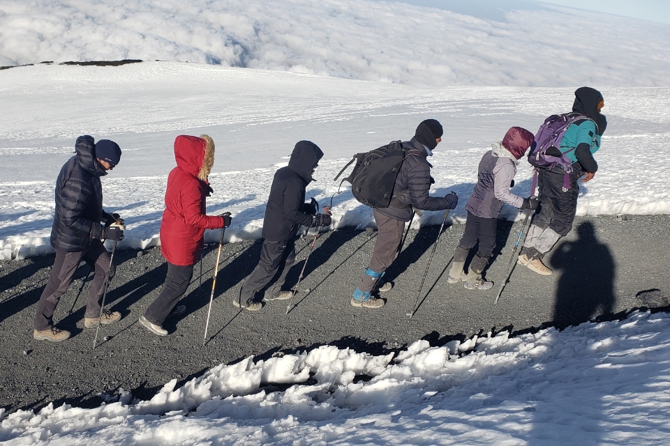 Climbers trekking toward the summit of Mount Kilimanjaro